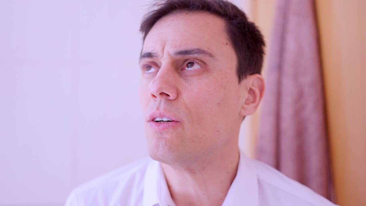 Businessman rehearsing speech, showing nervousness and anxiety