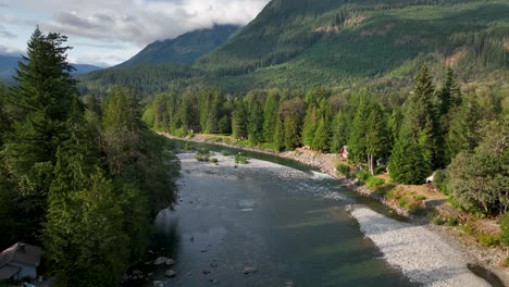 aerial view of the skykomish river passing through baring, washington on a sunny evening