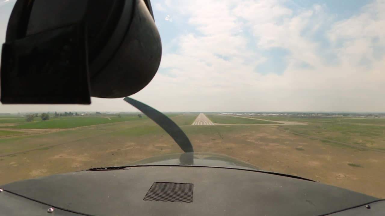 1969 Cessna 182N lands at Colorado airport during the summer