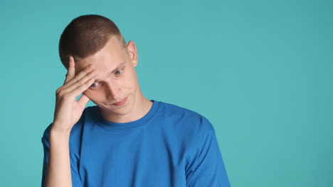 Worried-man-in-blue-T-shirt