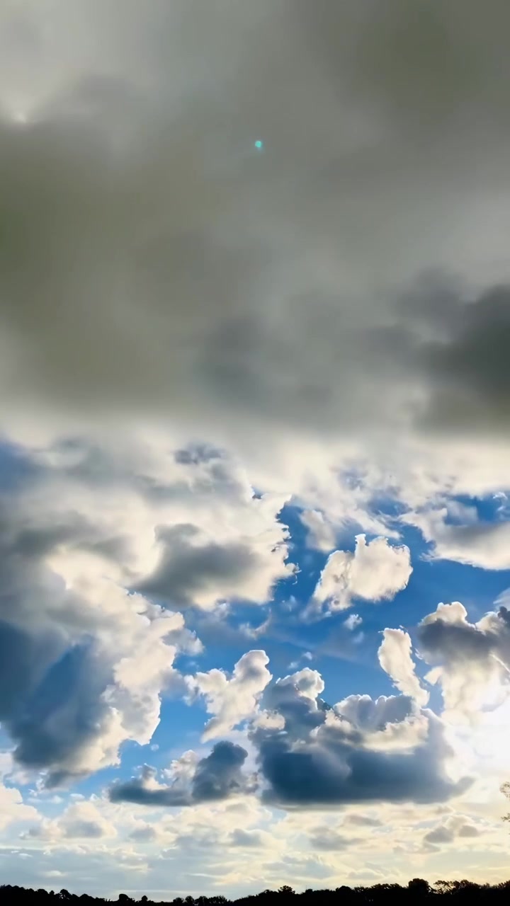 Time-Lapse of Fluffy Clouds Drifting Across a Vibrant Blue Sky