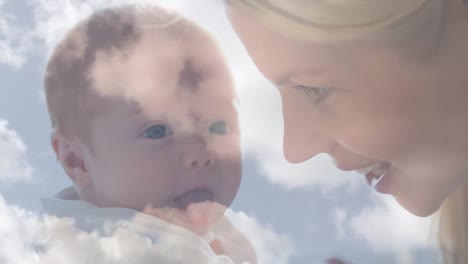 animation von wolken über glücklicher kaukasischer mutter, die ihr baby küsst