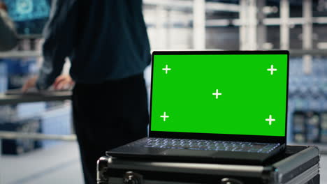data center programmers deploy deep learning software using green screen laptop