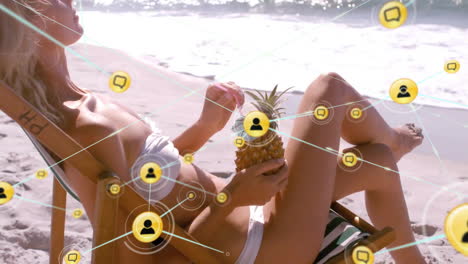 animation of networks of connections with people icons over caucasian woman in deckchair on beach