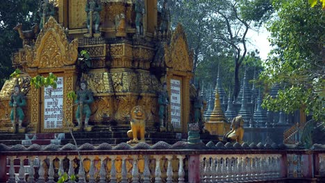 Medium-Shot-of-Pagoda-Shrines-With-Tree-Blowing