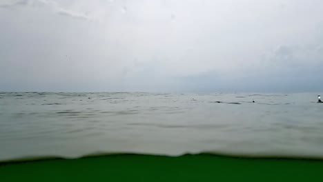 raindrops on sea surface and horizon in background