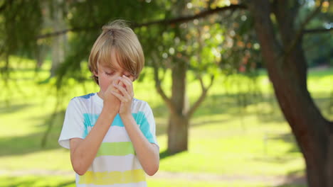 Little-boy-using-his-inhaler-in-the-park