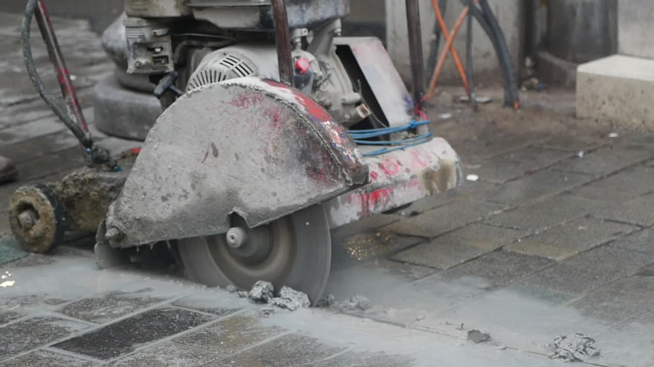 Industrial Concrete Saw Cutting Pavement on a Construction Site