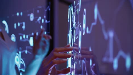 hand interacting with a futuristic digital touch screen