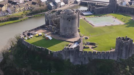 drone shot pembroke castle in the city of wales, uk