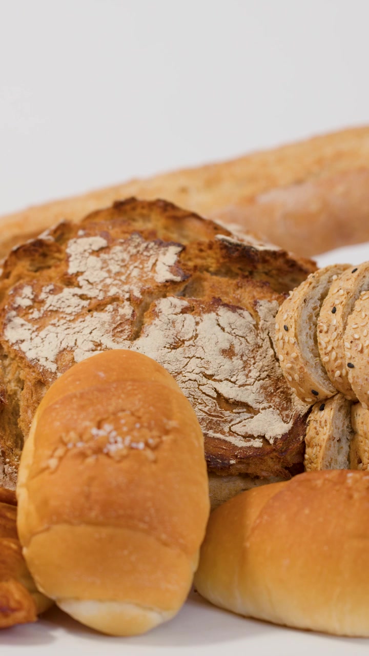 Hand Picking Fresh Bread Roll From Assortment