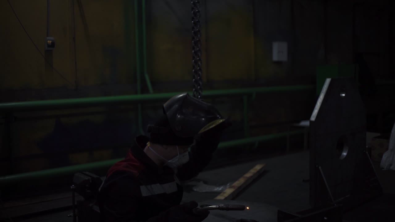 Industrial Welder at Night