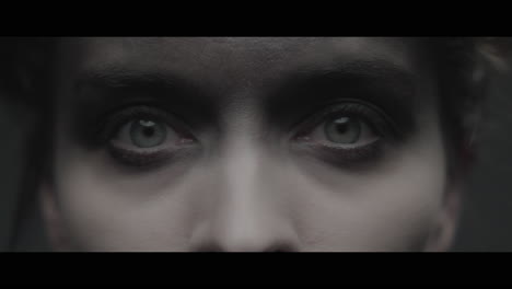 a woman dressed as mother opens her eyes