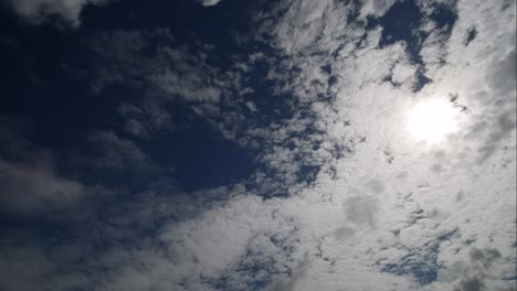 time lapse of white clouds covering sun during the late afternoon