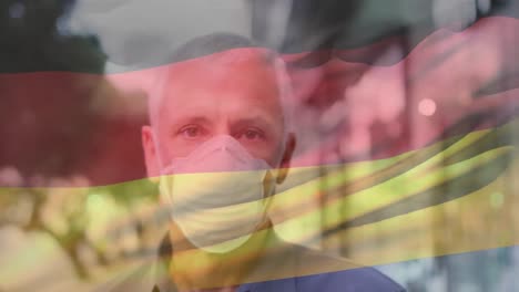 animación de la bandera de alemania ondeando sobre un hombre con máscaras faciales