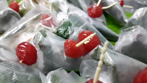 Closeup-footage-of-sweet-masala-Paan,-a-preparation-combining-betel-leaf-with-areca-nut,-tobacco-widely-consumed-throughout,-Southeast-Asia,-India,-and-Taiwan-as-a-mouth-freshener-after-a-meal