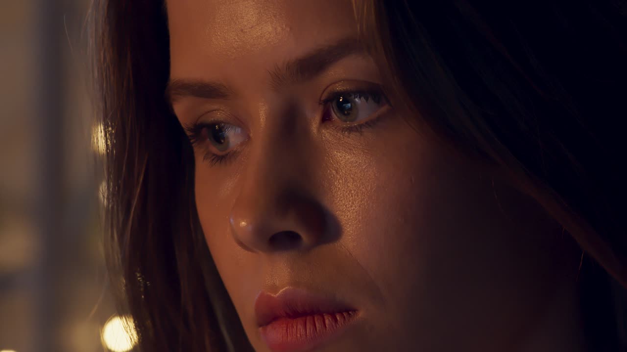 Close-up portrait of a thoughtful young woman