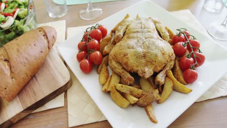 roasted chicken with cherry tomato in tray