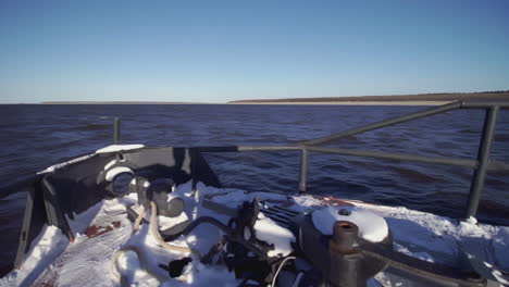 winter river cruise from a boat's deck