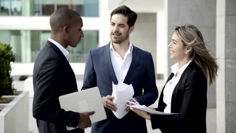 business professionals wearing office suits, standing together