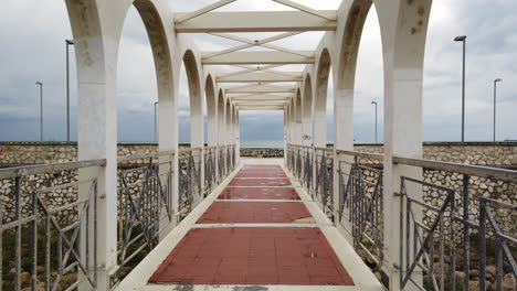 4k video of the view of a famous bridge inn civitavecchia, city with the main port in italy and especially in rome.