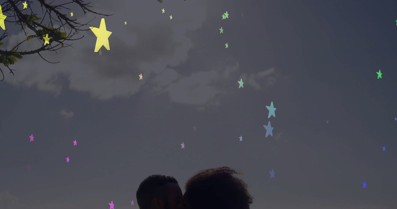 Drifting star graphics revealing silhouette while couple kissing romantically in convertible
