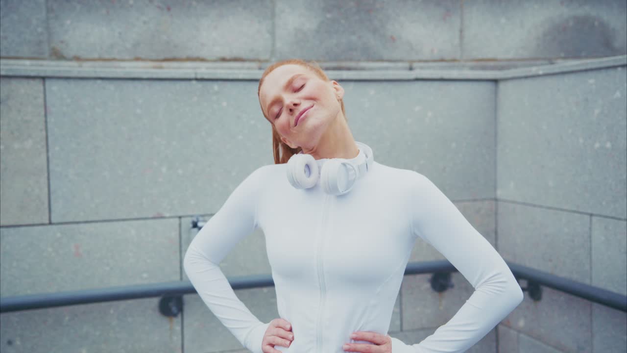 Redhead Woman Stretching Outdoors