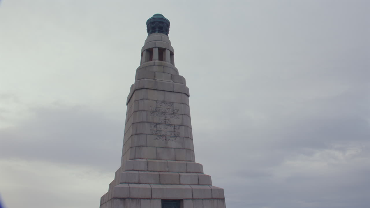 Wide shot Tilting up the War Memorial on top of Dundee Law hill