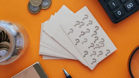 high angle view of question mark on paper on office desk