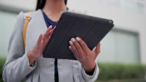 Hands,-tablet-and-woman-typing-in-city-for-social