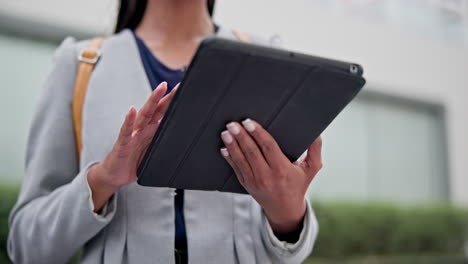 hands, tablet and woman typing in city for social