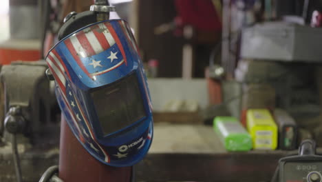 american decorated wielding helmet in an industrial workshop factory