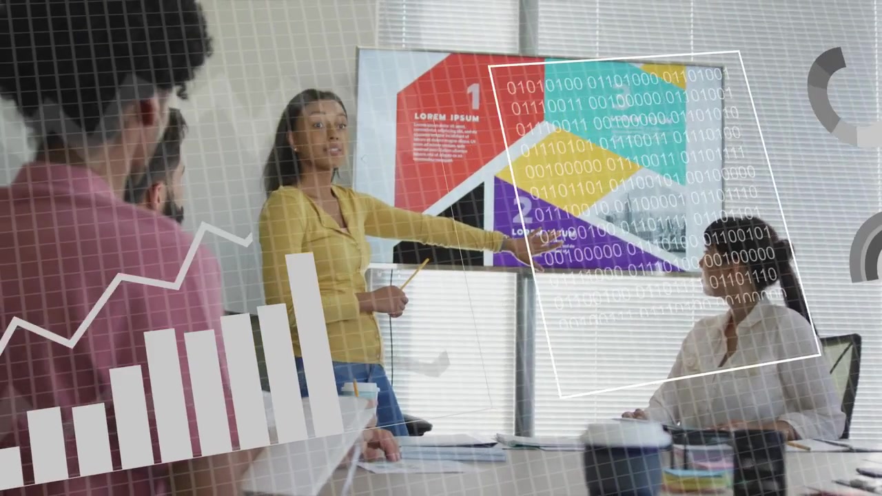 Woman presenting at monitor and tapping tablet, charts appearing and aiding business analysis