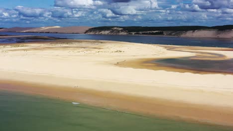 arcachon bay france with boats anchored along the banc d'arguin sandbank, aerial dolly left view