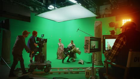 on big film studio professional crew shooting period costume drama movie. on set: directing green screen scene with gentleman protecting lady from actor playing monster wearing motion capture suit