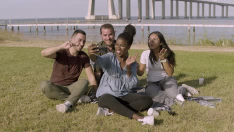 happy friends taking selfie with smartphone