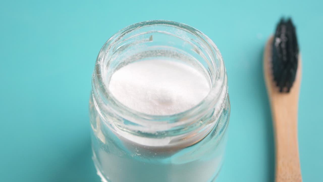 Baking Soda Powder and Wooden Toothbrush