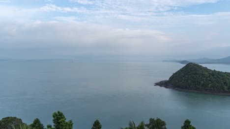 fast timelapse over beautiful open ocean with tropical green island