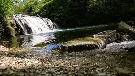 discover tranquility with this hd slow-motion video of a gentle waterfall, perfect for relaxation and nature-themed projects