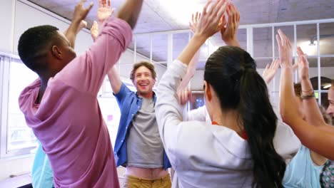 group of business executives forming hands stack