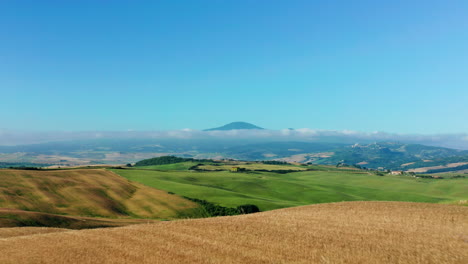 tuscany, italy. flying over field reveals beautiful country