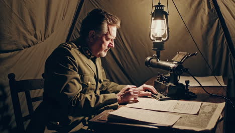 world war i officer communicating in a tent