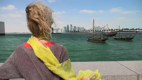 woman at doha skyline