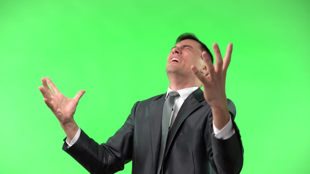 Businessman Expressing Extreme Frustration on Green Screen