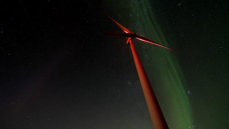 wind turbine under the aurora borealis