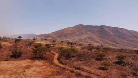 Aerial-view-response-helicopter-assisting-with-dry-grass-wildfire-disaster-in-rural-Monterrey-valley-in-the-La-Huasteca-region-of-Mexico