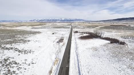 Large-valley-with-snow-covered-mountains-in-the-distance