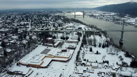 us, oregon, portland, st johns, 2025-02-14 - drone view of st johns outside of portland in the snow