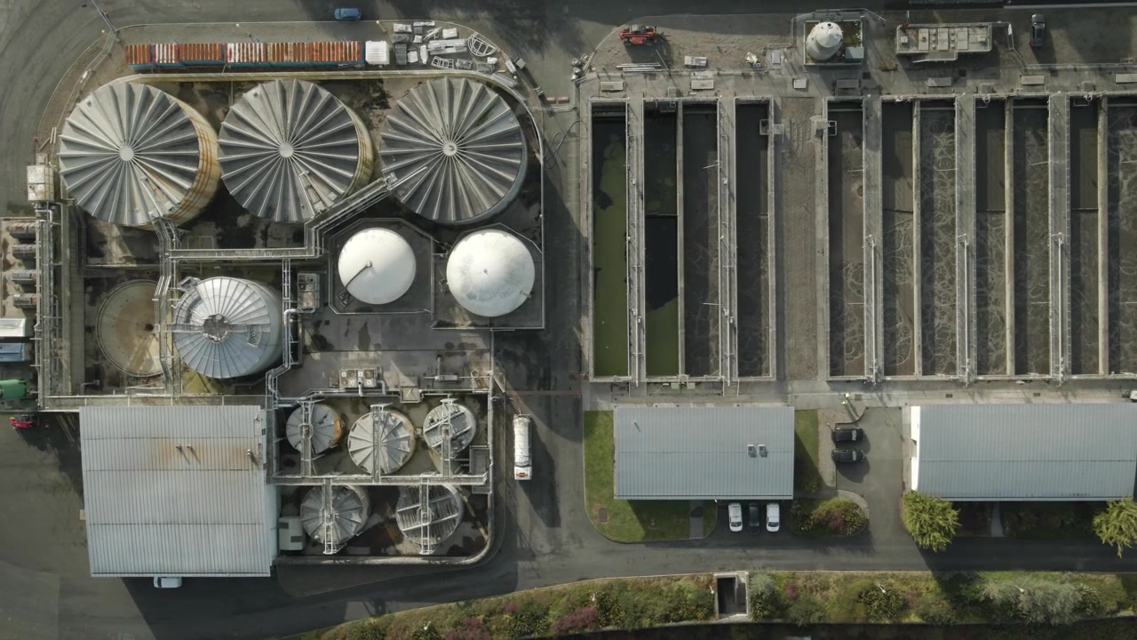 A wastewater treatment plant with tanks and facilities in drogheda, ireland , aerial view