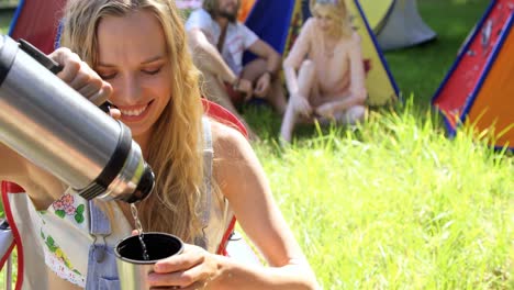 hipster woman serving himself a beverage